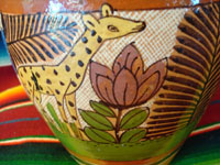 Closeup photo showing giraffe on Tonala vase.