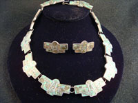 Mexican vintage silver jewelry, necklace and earrings set, inlaid with chips of Mexican jade, c. 1940.