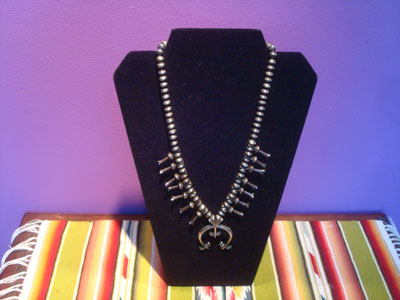 Native Amaerican vintege sterling silver jewelry, and Navajo vintage sterling silver jewelry, a beautiful squash blossom necklace, all silver with stamping on blossoms and Naja, Arizona or New Mexico, c. 1950's.