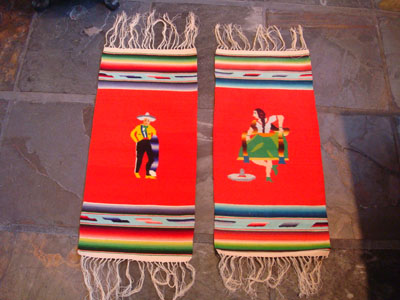 Mexican vintage textiles and Saltillo sarapes, a wonderful pair of matching Saltillo sarapes featuring a dashing Mexican charro (horseman) and a lovely China Poblana or charra dancing around a sombrero, c. 1940's.