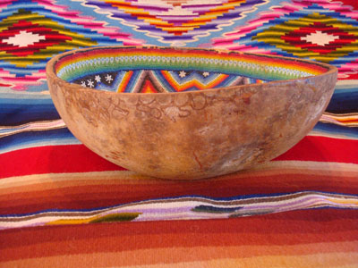 Mexican vintage folk-art, a beautiful beaded Huichol gourd, c. 1950. The beadwork is extremely intricate and fine; this is a stunning piece in the traditional style of the Huichol of the Sierras of Nayarit.