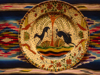 Mexican vintage pottery and ceramics, a magnificent Tlaquepaque plate with a starry-night background and decorated with leaping animals and birds, Tlaquepaque, Jalisco, c. 1920-30's. Attributed to the famous artist, Balbino Lucano or his brother Tomas Lucano.
