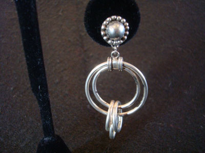 Mexican vintage silver jewelry and Taxco vintage silver jewelry, a wonderful pair of hoop-style earrings, Taxco, c. 1940's. These beautiful earrings, for pierced ears, have lovely hoops within hoops. They are incredibly graceful and beautiful.