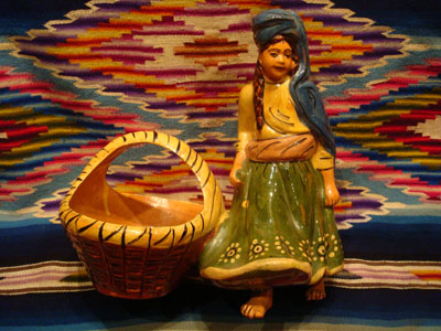 Mexican vintage pottery and ceramics and Mexican vintage folk-art, a lovely pottery figurine depicting a lovely woman with a basketl, Tlaquepaque, Jalisco, c. 1930's.