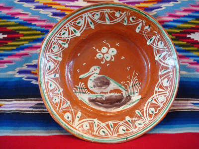 Mexican vintage pottery and ceramics, a bandera-ware plate with a graceful pelican and wonderfully intricate border, Tonala or Tlaquepaque, Jalisco c. 1930's.