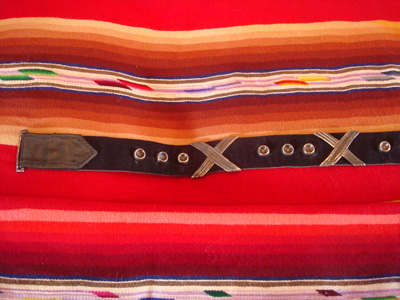 Mexican and Taxco vintage sterling silver jewelry, a wonderful silver belt by the famous artist Hector Aguilar, Taxco c. 1940's. The belt features four X's and 15 silver bump-outs, all mounted on a  beautiful black leather belt.