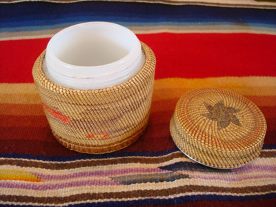 Native American Indian antique basket, a finely woven Northwest Coast basket, woven around a Pond's Cold Cream Jar and lid, Nootka or Makah Indians, c. 1920's. The weaving features wonderful eagles on two sides of the jar.