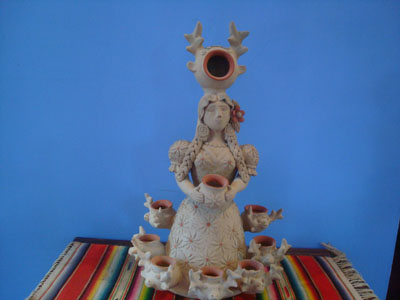 Mexican vintage folk art, a lovely pottery statue of a woman with a crown of deer and deer at the hem of her skirt, Atzompa, Oaxaca, c. 1960.