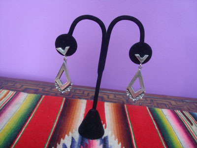 Mexican vintage sterling silver jewelry, and Taxco vintage sterling silver jewelry, a beautiful pair of dangling sterling silver earrings, Taxco, c. 1940's.